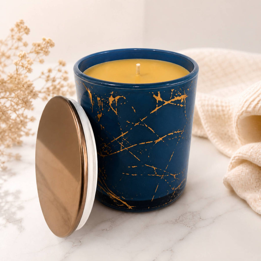 Blue marble glass beeswax candle with rose gold finish
